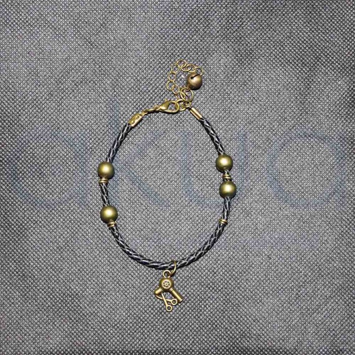 Pulsera Negra con abalorio Bronce